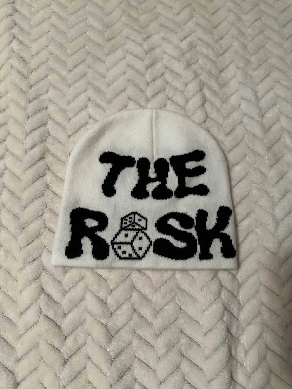 “THE RISK" Black Text and Dice Graphic White Beanie